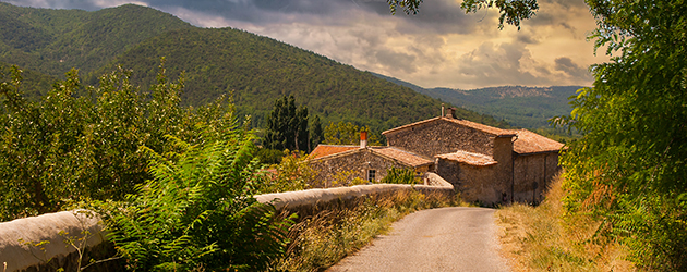 Stone farm house along a road in the South of France